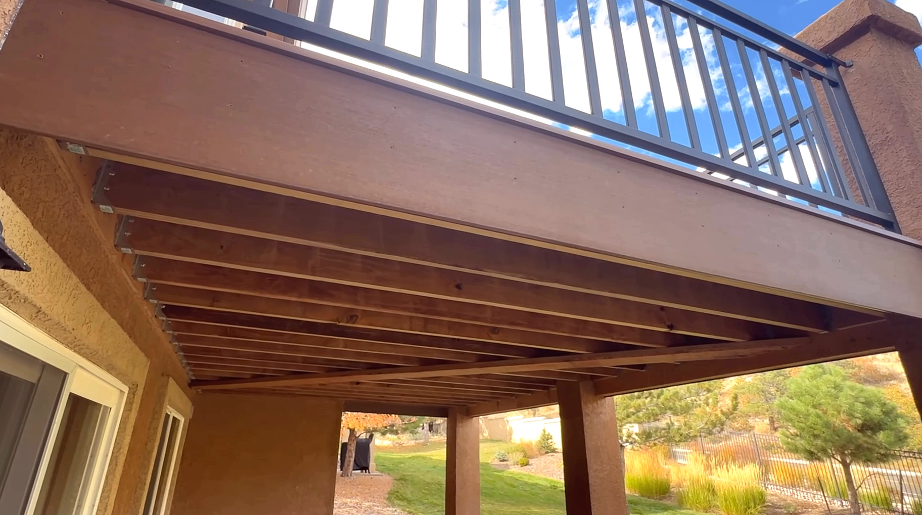 The underside of a Stoddard deck frame, showing joist spacing and beam detail